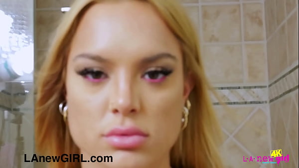 Glamorous blonde beauty enjoys a sensual shower